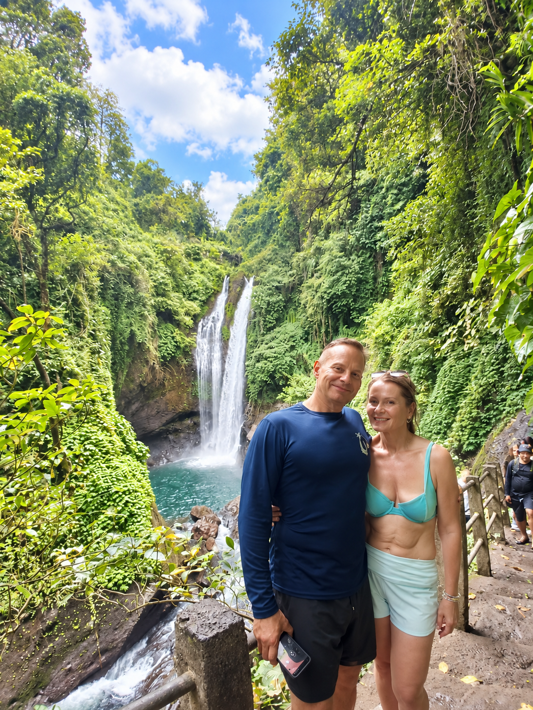 Guests exploring a waterfall in North Bali